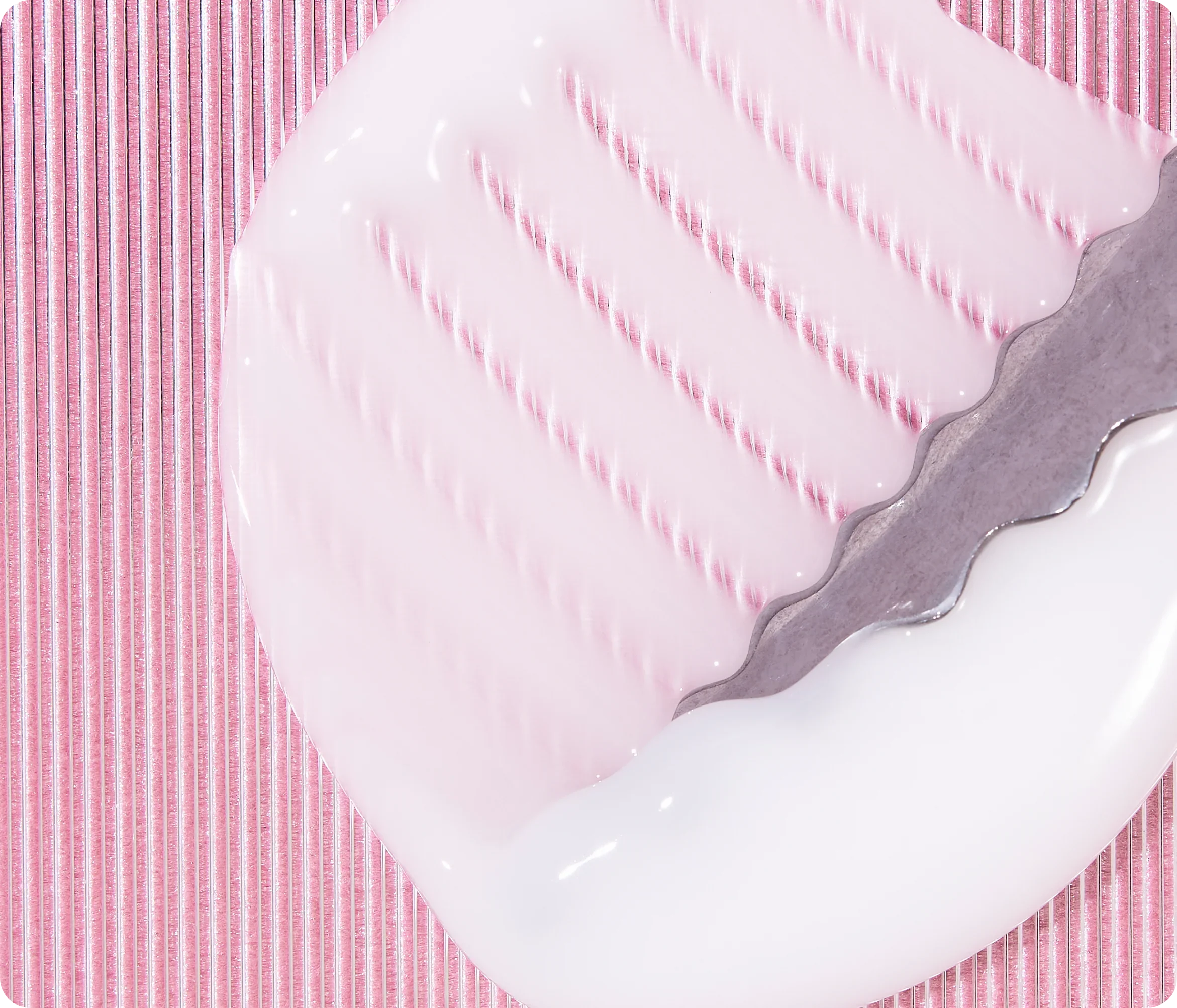 Pink cream swirl on a pink ribbed surface